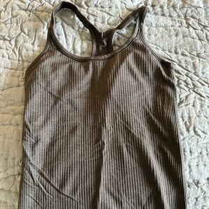 Lulu Lemon rubbed yoga tank; size 6 gray with shelf bra and inserts